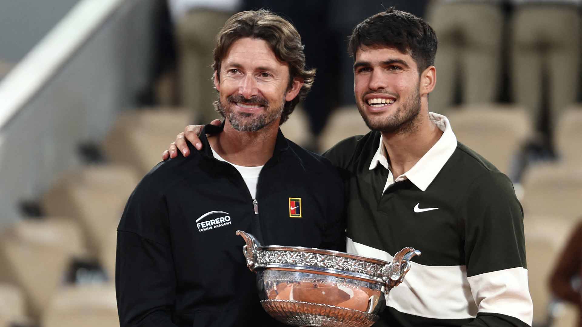 Juan Carlos Ferrero and Carlos Alcaraz celebrate the 22-year-old's Roland Garros triumph against Jannik Sinner.
