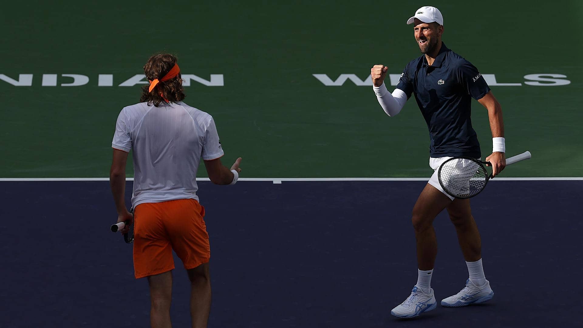 Stefanos Tsitsipas and Novak Djokovic in action Tuesday at the BNP Paribas Open.